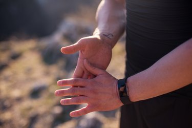 close view of a person's hands, to show their sweaty palms